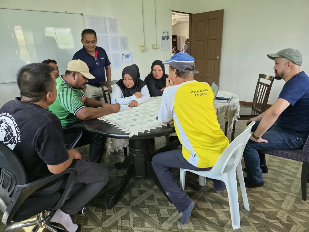 Consultants and community representatives meeting around a table